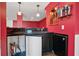 A mini fridge and a wet bar with granite countertops for a lavish entertainment space at 6020 Ettington Dr, Suwanee, GA 30024