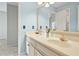 Bathroom with granite countertop vanity, double sinks and a decorative mirror and decor at 6020 Ettington Dr, Suwanee, GA 30024