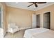 Bright bedroom featuring a ceiling fan, a neutral color palette and plush carpeting at 6020 Ettington Dr, Suwanee, GA 30024