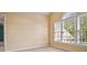 Bright bedroom with neutral walls, plush carpet, and large windows at 6020 Ettington Dr, Suwanee, GA 30024