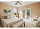 Cozy bedroom with French doors leading to a private balcony at 6020 Ettington Dr, Suwanee, GA 30024