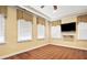 Bright bedroom with neutral walls, carpeted floors, and large windows with custom blinds at 6020 Ettington Dr, Suwanee, GA 30024