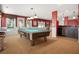 The game room is outfitted with a pool table, bar seating, and a counter with a sink at 6020 Ettington Dr, Suwanee, GA 30024