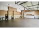 Spacious garage with white cabinets, ample storage, and epoxy-coated floor at 6020 Ettington Dr, Suwanee, GA 30024