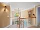 Elegant hallway featuring a staircase, chandelier and views of the foyer at 6020 Ettington Dr, Suwanee, GA 30024