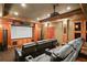 Entertainment room with tiered seating, custom wood trim, a projector and a large screen at 6020 Ettington Dr, Suwanee, GA 30024