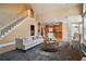 Spacious living room featuring an open floor plan and staircase at 6020 Ettington Dr, Suwanee, GA 30024