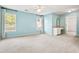Light-filled main bedroom with an ensuite bathroom and ample space for a seating area at 6020 Ettington Dr, Suwanee, GA 30024