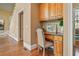 Charming office nook with custom cabinetry and a comfortable chair at 6020 Ettington Dr, Suwanee, GA 30024