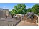 Well-equipped outdoor kitchen with stone accents and built-in appliances at 6020 Ettington Dr, Suwanee, GA 30024