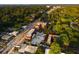 An aerial view showcases the building nestled among lush trees and city views at 677 Somerset Ne Ter # C6, Atlanta, GA 30306