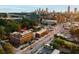 Beautiful aerial view of building with rooftop terrace, city skyline and surrounding landscape at 677 Somerset Ne Ter # C6, Atlanta, GA 30306