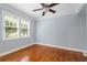 Inviting bedroom boasts hardwood floors, a ceiling fan, and sun-filled windows at 677 Somerset Ne Ter # C6, Atlanta, GA 30306