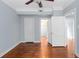 Bright bedroom featuring hardwood floors and neutral paint with access to storage at 677 Somerset Ne Ter # C6, Atlanta, GA 30306