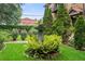 Building's courtyard with manicured shrubbery and stone fountain at 677 Somerset Ne Ter # C6, Atlanta, GA 30306