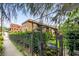 Charming exterior with mature landscaping and secure gate entrance, ensuring privacy and curb appeal at 677 Somerset Ne Ter # C6, Atlanta, GA 30306