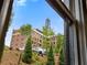 Exterior view from window showcases lush landscaping and the neighborhood surroundings at 677 Somerset Ne Ter # C6, Atlanta, GA 30306