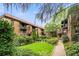 Building exterior with lush green courtyard and walking path at 677 Somerset Ne Ter # C6, Atlanta, GA 30306