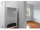 Hallway with a deep, open closet and hardwood floors at 677 Somerset Ne Ter # C6, Atlanta, GA 30306