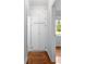 Hallway with built-in storage cabinets and hardwood floors at 677 Somerset Ne Ter # C6, Atlanta, GA 30306