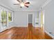 Inviting living area with hardwood flooring, ceiling fan, and an open doorway to another room at 677 Somerset Ne Ter # C6, Atlanta, GA 30306