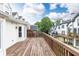 Wide view of the wooden back deck of a home with views of the neighborhood at 911 Lenox Hill Ne Ct, Atlanta, GA 30324