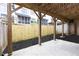 Wooden pergola covers a concrete patio with a new wooden fence at 911 Lenox Hill Ne Ct, Atlanta, GA 30324