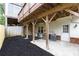 Backyard with a covered patio and a freshly mulched garden at 911 Lenox Hill Ne Ct, Atlanta, GA 30324