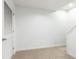 Unfinished basement featuring clean, neutral carpet and a doorway, ready to be customized at 911 Lenox Hill Ne Ct, Atlanta, GA 30324