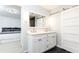 Stylish bathroom with modern double vanity, sliding door, and a view into the bedroom at 911 Lenox Hill Ne Ct, Atlanta, GA 30324