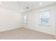 Bright bedroom with neutral carpet, white walls, and windows offering plenty of natural light at 911 Lenox Hill Ne Ct, Atlanta, GA 30324
