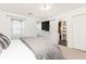 Bedroom with neutral carpet, bright lighting and a closet with white sliding doors at 911 Lenox Hill Ne Ct, Atlanta, GA 30324