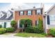 Charming red-brick townhome with black shutters and well-manicured landscaping at 911 Lenox Hill Ne Ct, Atlanta, GA 30324