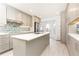 Modern kitchen with stainless steel appliances, gray cabinets, and a bright white countertop island at 911 Lenox Hill Ne Ct, Atlanta, GA 30324