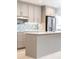 Kitchen featuring a gray island, stainless steel appliances, and modern gray cabinets at 911 Lenox Hill Ne Ct, Atlanta, GA 30324