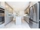 This kitchen features stainless steel appliances, white countertops, and grey cabinets at 911 Lenox Hill Ne Ct, Atlanta, GA 30324