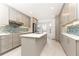 Stylish kitchen featuring gray cabinetry, stainless steel appliances, and a central island at 911 Lenox Hill Ne Ct, Atlanta, GA 30324
