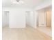 Bright living area featuring multiple doorways, light hardwood floors, and neutral walls at 911 Lenox Hill Ne Ct, Atlanta, GA 30324