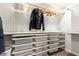 Organized walk-in closet with ample shelving, drawers, and hanging space to neatly store clothing and accessories at 911 Lenox Hill Ne Ct, Atlanta, GA 30324
