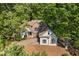 A serene house surrounded by lush greenery, offering privacy and tranquility at 115 Stonewall Dr, Covington, GA 30016