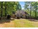 Backyard with a wood deck great for entertaining. Home has a private, wooded area for seclusion at 115 Stonewall Dr, Covington, GA 30016