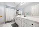 Neutral bathroom with a shower and tub combination and a large vanity at 115 Stonewall Dr, Covington, GA 30016