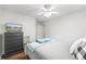 Bedroom features wood floors, a TV, a chest of drawers, and a comfortable bed at 115 Stonewall Dr, Covington, GA 30016