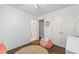 A simple bedroom featuring a bed, closet, and personal items at 115 Stonewall Dr, Covington, GA 30016