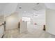 Large bonus room offers flexible space for recreation, exercise, or a home office at 115 Stonewall Dr, Covington, GA 30016
