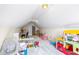 The bonus room offers ample space for a playroom with toys and study area at 115 Stonewall Dr, Covington, GA 30016