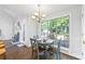 Bright breakfast nook area with hardwood floors and large window with view to back yard at 115 Stonewall Dr, Covington, GA 30016