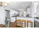Kitchen featuring breakfast bar and stainless steel appliances at 115 Stonewall Dr, Covington, GA 30016
