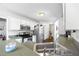Well lit kitchen featuring white cabinets, stainless steel appliances, and a convenient layout at 115 Stonewall Dr, Covington, GA 30016