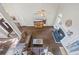 Bright open living room with a fireplace, hardwood floors and an exterior door leading to the yard at 115 Stonewall Dr, Covington, GA 30016
